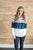 Model showing front view of striped hoodie.
